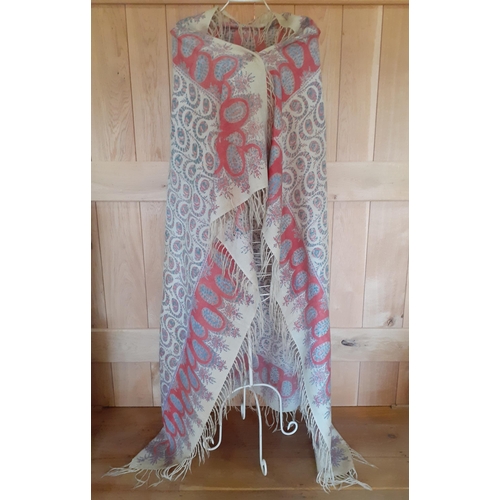 15 - A Victorian printed cotton crinoline shawl having a cream background with sprays and swags of salmon... 