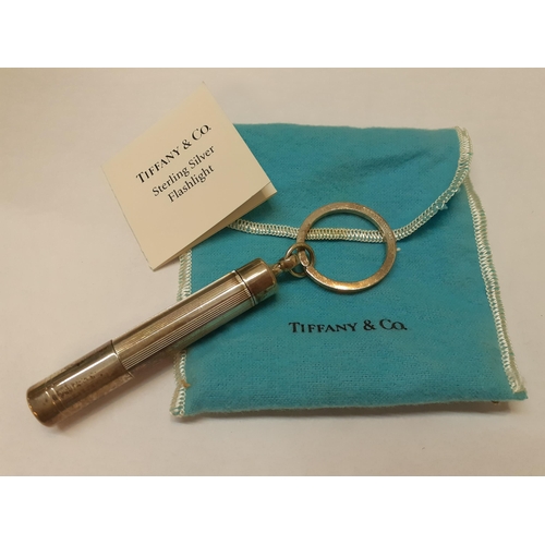 2 - Tiffany-A Sterling silver flashlight, 72g, together with an iconic blue branded bag. Location:Cab2