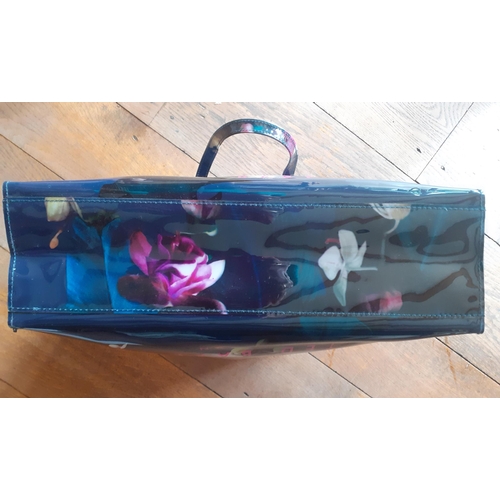 21 - Ted Baker- A modern 'Fuchsia' floral tote shopper, having a white interior with zipped pocket, 37cm ... 