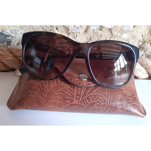 22 - Ralph Lauren-A pair of ladies brown tortoiseshell effect sunglasses with gold tone ornate metal inla... 