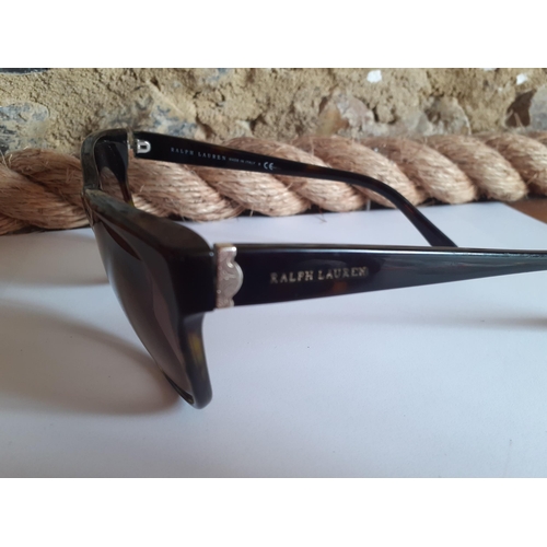 22 - Ralph Lauren-A pair of ladies brown tortoiseshell effect sunglasses with gold tone ornate metal inla... 