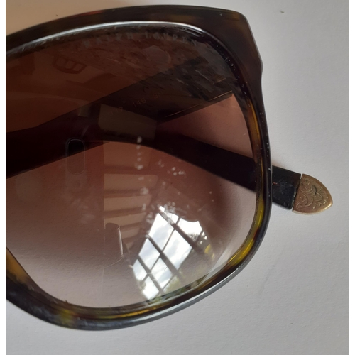 22 - Ralph Lauren-A pair of ladies brown tortoiseshell effect sunglasses with gold tone ornate metal inla... 