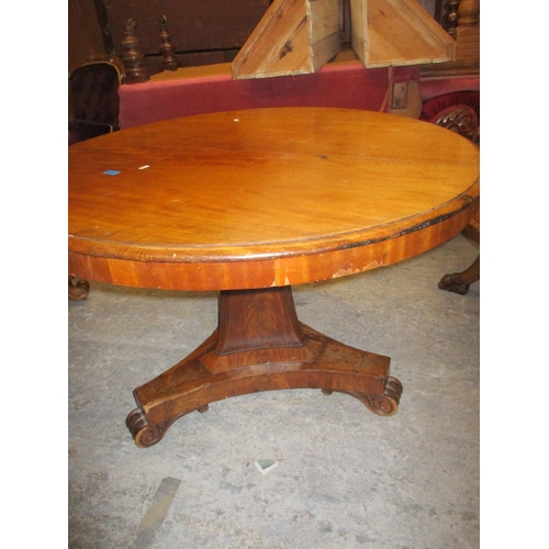 249 - A mahogany Regency style pedestal breakfast table, circular top with moulded edge, supported on a ta... 