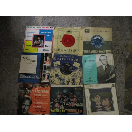 253 - An early to mid 20th century Apollo wind-up gramophone with a selection of singles, LPs and 78rpm re... 