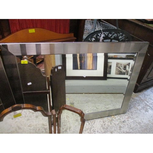 22 - Two modern silver framed mirrors and a walnut triptych mirror
Location: ROS