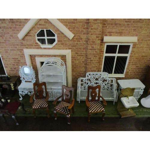 24 - A dolls house with a double front and various dolls house furniture. Location:G