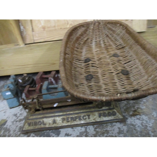 34 - An antique Virol cast iron infants scale with wicker cradle and a selection of weights
Location: G