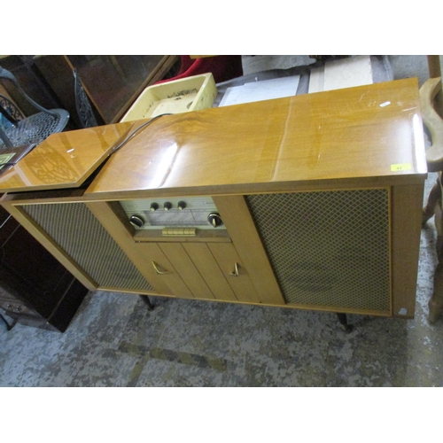 42 - A mid century Dynatron Henley radiogram RG21A, walnut case, housing speakers and a Garrard turntable... 