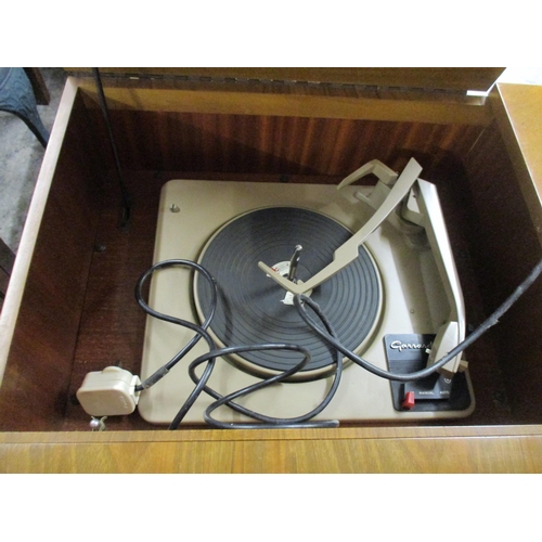 42 - A mid century Dynatron Henley radiogram RG21A, walnut case, housing speakers and a Garrard turntable... 