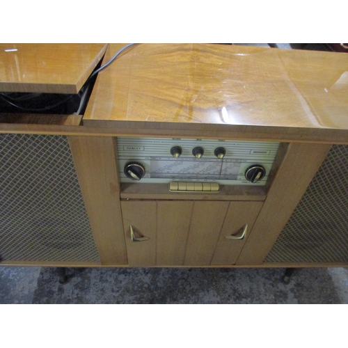 42 - A mid century Dynatron Henley radiogram RG21A, walnut case, housing speakers and a Garrard turntable... 