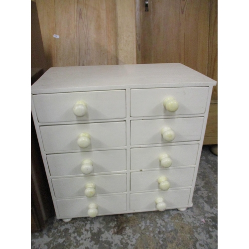 45 - A mid 20th century walnut six drawer chest of small proportions and a white painted pine ten drawer ... 