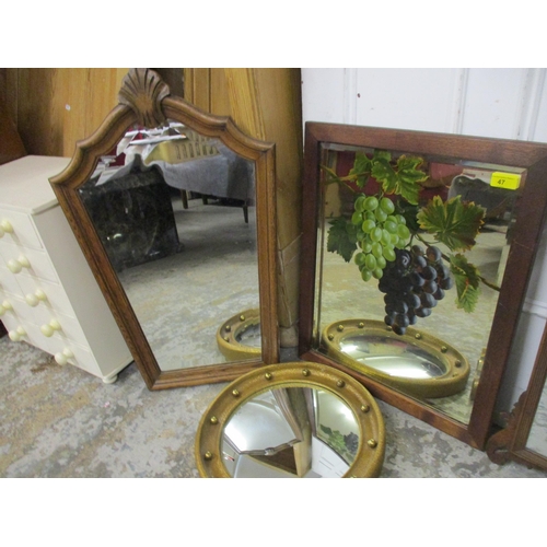 47 - Four mirrors to include an oak framed example painted with grapes, signed, a 19th century Queen Anne... 