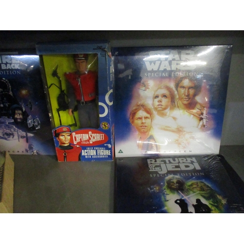 54 - A group of Star Wars and Captain Scarlett toys and laser discs to include a boxed Captain Scarlett a... 