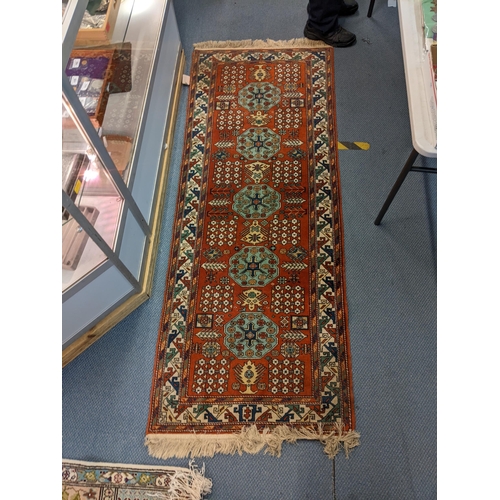 16 - A Caucasian runner with geometric motifs and a Tunisian rug with panels
Location: BR/LAB