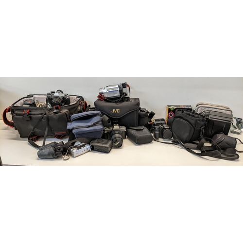 18 - A selection of cameras and accessories to include a Canon AE-I, Fujifilm S1000, JVC video camera and... 