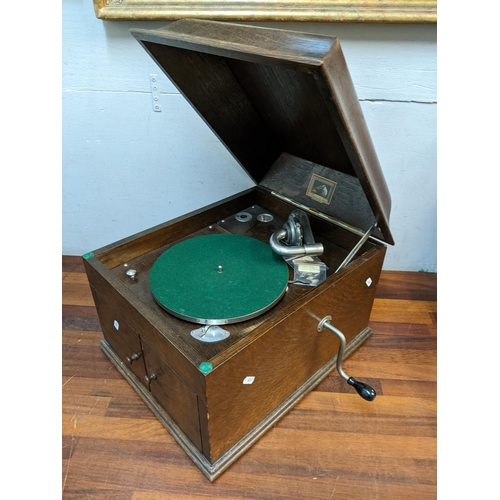 270 - THIS ITEM IS WITHDRAWN - A His Masters Voice oak cased table top gramophone together with mixed reco... 