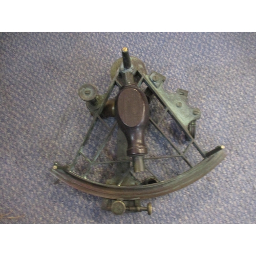 446 - A nautical 19th century sextant in lacquered brass with rosewood handle, with spare, lenses, mahogan... 