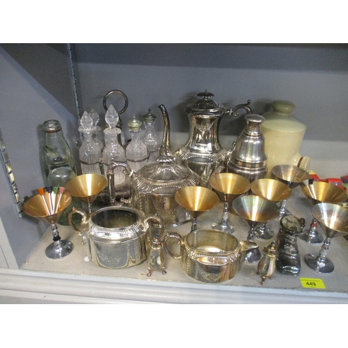 449 - A mixed lot of silver plate and other items to include a seven bottle cruet stand and bottles (one b... 