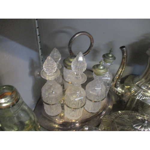 449 - A mixed lot of silver plate and other items to include a seven bottle cruet stand and bottles (one b... 