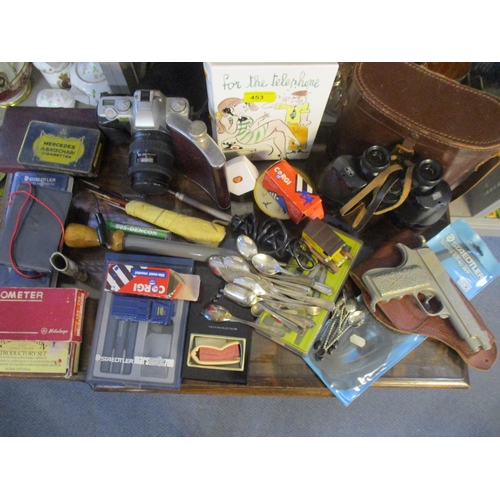 453 - A mixed lot to include a leather cased Ross of London binoculars, a Pentax M2-5 film camera, tools, ... 