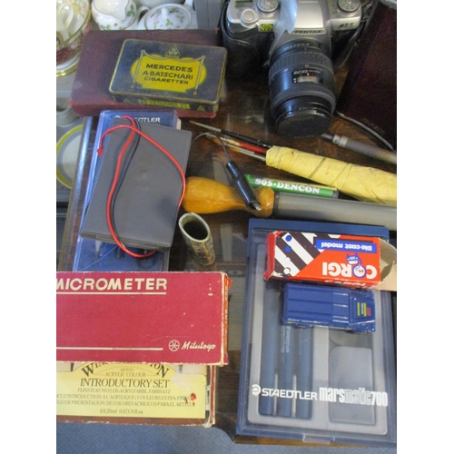 453 - A mixed lot to include a leather cased Ross of London binoculars, a Pentax M2-5 film camera, tools, ... 