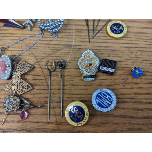 57 - Costume jewellery to include a micro mosaic brooch, a Brook Motors Limited enamel badge, Saga Club b... 