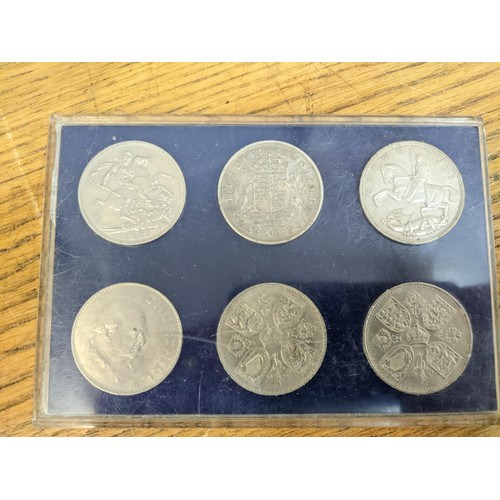 58 - Coins to include two Roman examples six crowns, two uncirculated coin collections and others, a £1 a... 