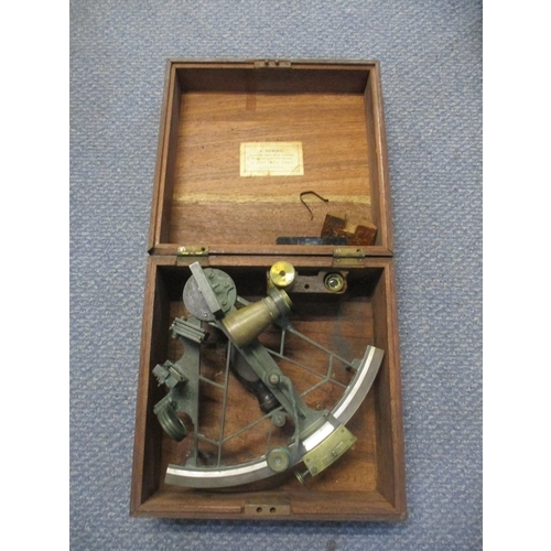 446 - A nautical 19th century sextant in lacquered brass with rosewood handle, with spare, lenses, mahogan... 