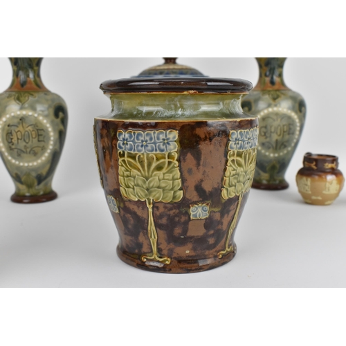 19 - A collection of Royal Doulton pottery, to include a pair of Edwardian vases and lidded pot with G. P... 