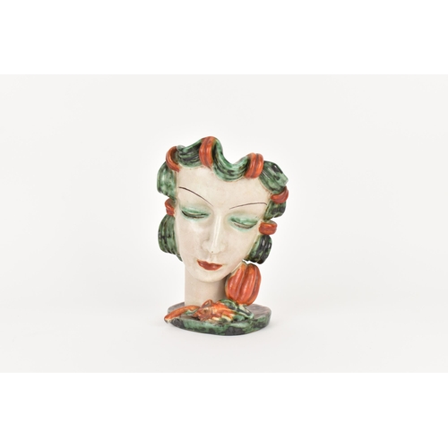 20 - An Art Deco period Goldscheider pottery mask, model no.6305, modelled as a lady with green curled ha... 