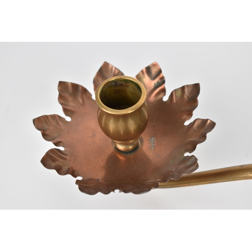 22 - An Arts and Crafts copper and brass counterbalance candlestick by W.A.S. Benson, with stylised leaf ... 