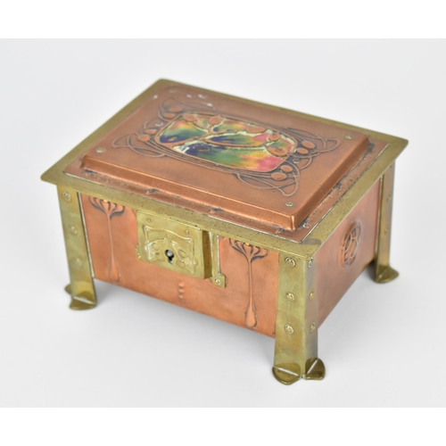 24 - An Arts & Crafts copper, brass and enamel box, with four brass rivet brackets to each corner against... 