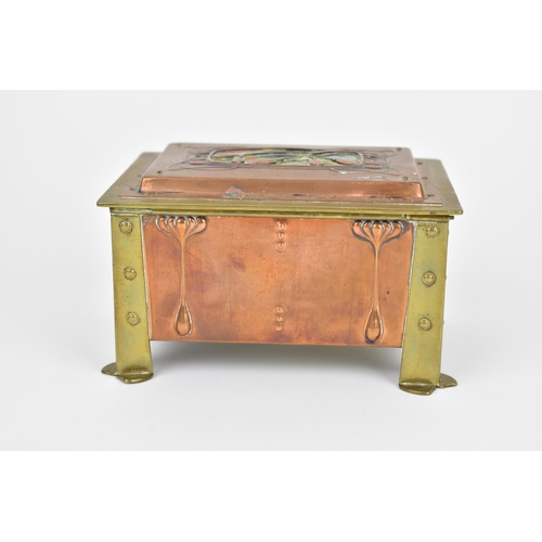 24 - An Arts & Crafts copper, brass and enamel box, with four brass rivet brackets to each corner against... 