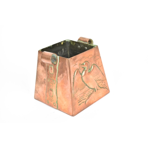 31 - An Arts & Crafts Newlyn copper pot, of square tapered form with embossed fish and a gull with a fish... 