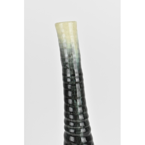 32 - A French mid century studio pottery vase by Accolay jug, designed with long tapered ribbed neck in g... 