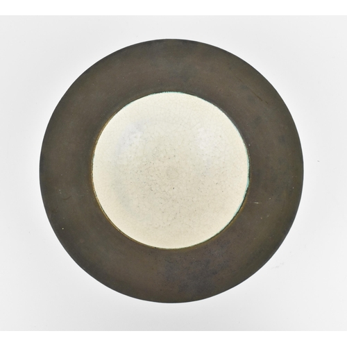 33 - Edith Holt (b.1933) British, a raku pottery bowl, with cream crackled centre surrounded by a matt gl... 