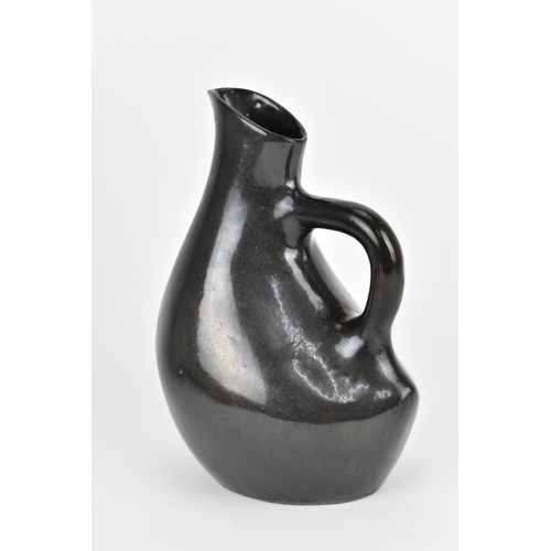 34 - Possibly by Jacques (1926-2008) and Dani (1933-2010) Ruelland, a manganese earthenware jug, in a sty... 