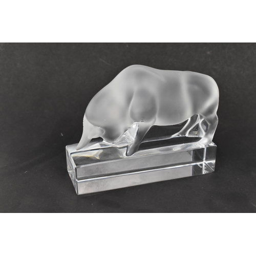 103 - This Lot Has Been Withdrawn

A Lalique frosted glass paperweight model of a bull, on a rectangular t... 