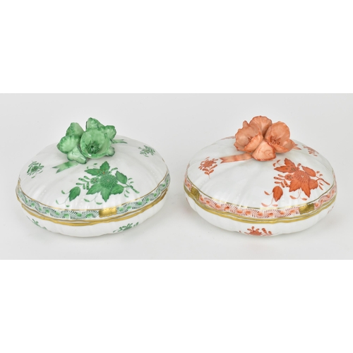 105 - Two Herend porcelain lidded boxes in the 'Apponyi' pattern, green and orange, each with Chinese bouq... 