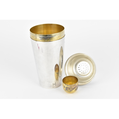 75 - An Art Deco silver plated and gilt recipe cocktail shaker, circa 1930, with strainer section, the gi... 