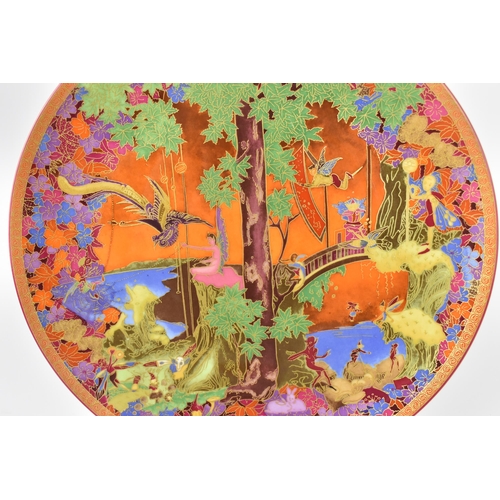 79 - A Wedgwood Fairyland Lustre dish, design by Daisy Makeig Jones, depicting leap-frogging elves and pi... 