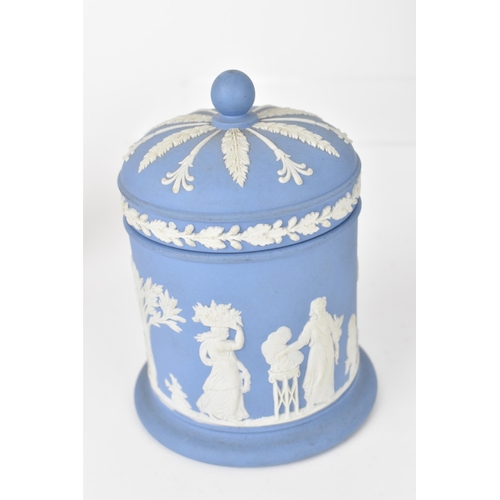 83 - A small collection of Wedgwood jasperware, to include a blue and white lidded urn with classical cam... 