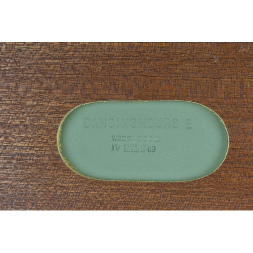 84 - A framed Wedgwood 'Dancing Hours' sage jasperware plaque, the reverse with factory mark and date '89... 