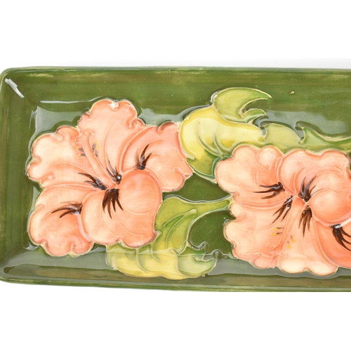 88 - A late 20th century Moorcroft pottery 'Hibiscus' rectangular tray, together with a Moorcroft 'anemon... 