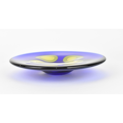 94 - A Czech studio glass dish by Ales Valner, of circular form in cobalt blue with four yellow blobs to ... 