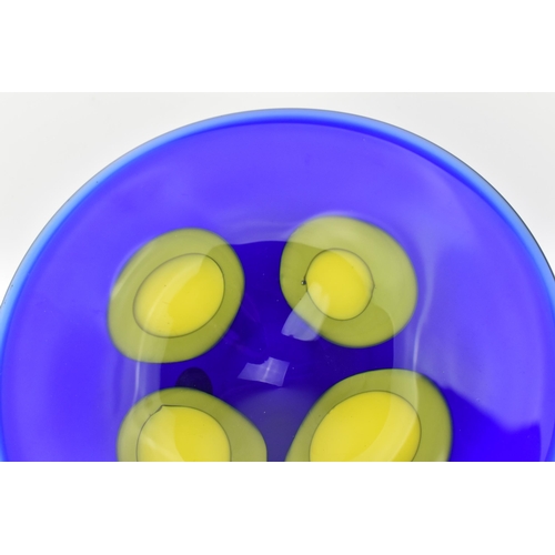 94 - A Czech studio glass dish by Ales Valner, of circular form in cobalt blue with four yellow blobs to ... 