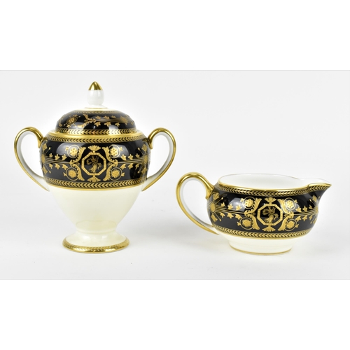 117 - A Wedgwood porcelain lidded urn, in the 'Astbury' pattern, with twin-handles, the black banded top s... 