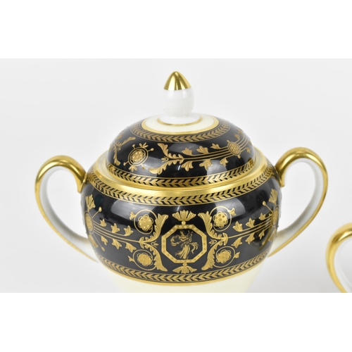 117 - A Wedgwood porcelain lidded urn, in the 'Astbury' pattern, with twin-handles, the black banded top s... 