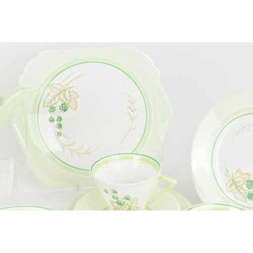 119 - An early 20th century Art Deco Shelley tea set, circa 1930s, in a green design with berries on leaf ... 