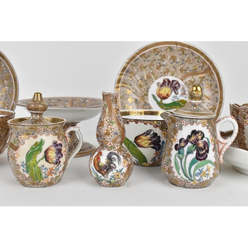 123 - A late 19th century Hungarian porcelain part tea set by Fischer Vilmos, Kolozsvá, comprising two set... 